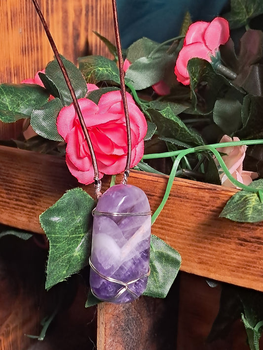 Purple amethyst pendant wrapped in silver wire